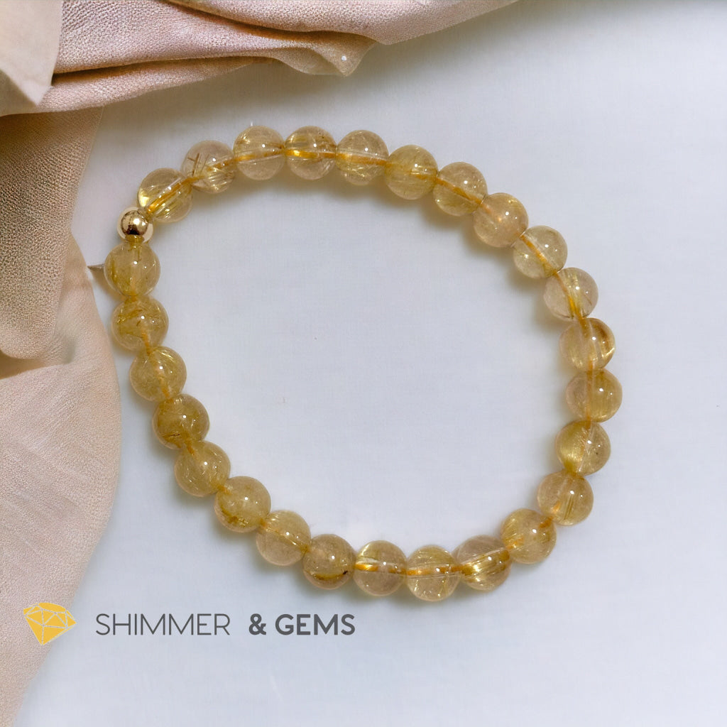 Golden Rutilated 7mm AAAA Grade Bracelet with 14k gold filled Bead