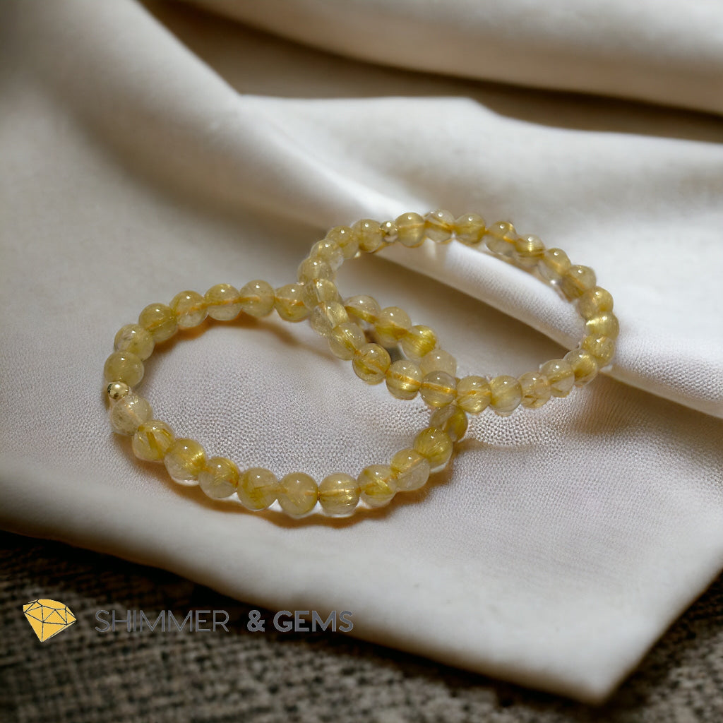 Golden Rutilated 7mm AAAA Grade Bracelet with 14k gold filled Bead
