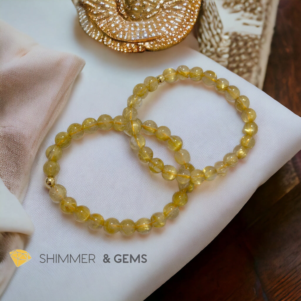 Golden Rutilated 7mm AAAA Grade Bracelet with 14k gold filled Bead